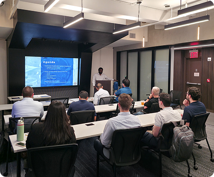 Guests attending a wastewater technology presentation and networking event.